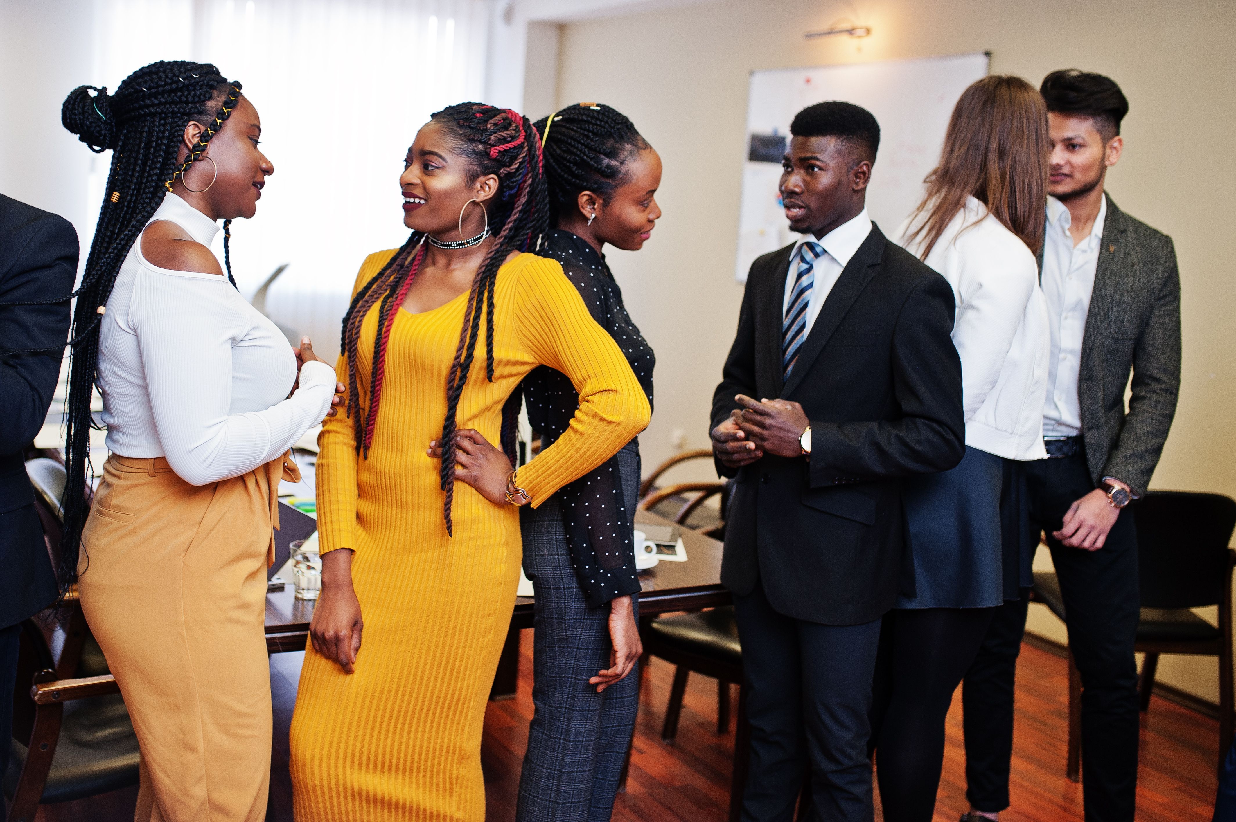 multiracial-business-people-standing-office-discuss-together-diverse-group-employees-formal-wear.jpg